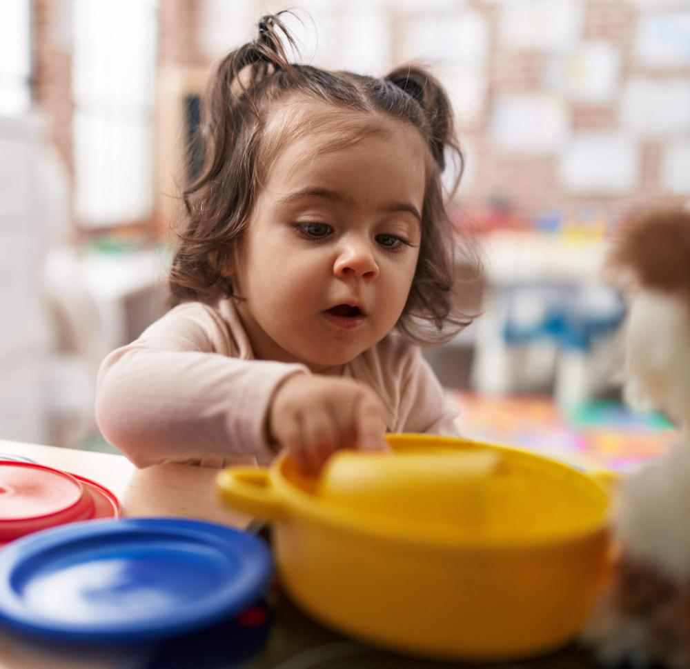 toddler-learning image Toddler engaging with learning materials