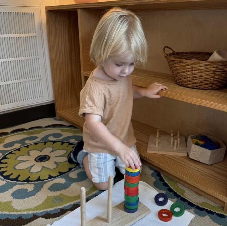 first-18-months image Baby exploring Montessori materials